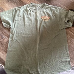 Ron Jon T-Shirt size M with a greenish color